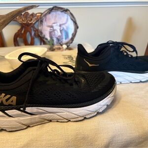 Hoka Black and Gold Athletic Shoes